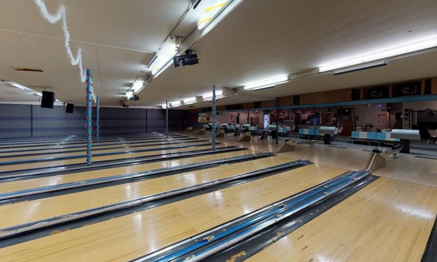 Interior picture of bowling lanes. 