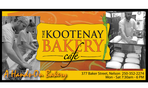 Orange and yellow sign with black lettering saying Kootenay Bakery Cafe