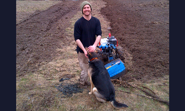 Andrew Bennet with the farm dog, Orim and a BCS walking tractor.