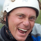 Man in a helmet smiling. 