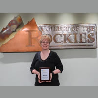 College of the Rockies’ Articulation Officer, Karen Langan, proudly shows off her BCCAT Rising Star award.
