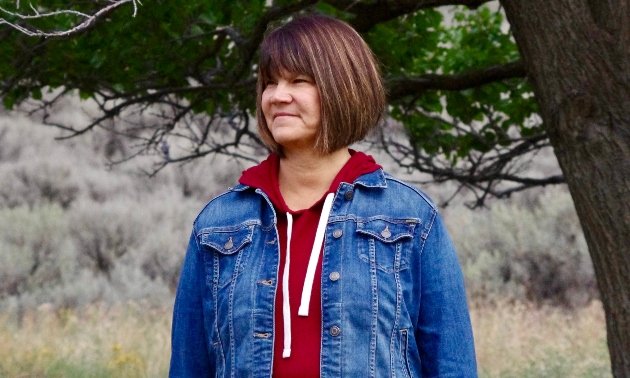 Kelly Terbasket standing in a field