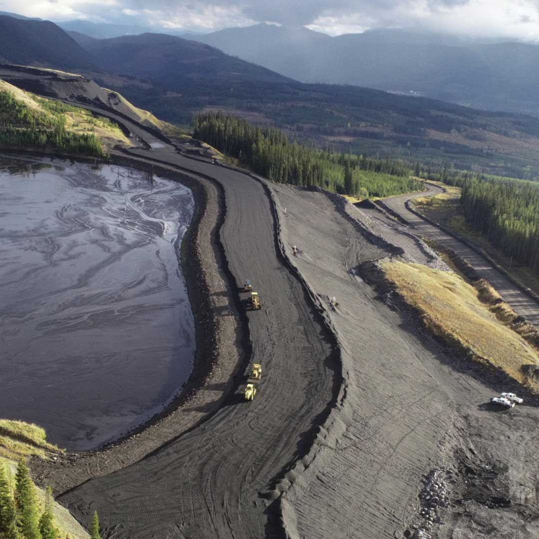 Overview of Kettle River Contracting operation with trucks at the worksite