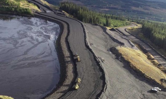 Overview of Kettle River Contracting operation with trucks at the worksite