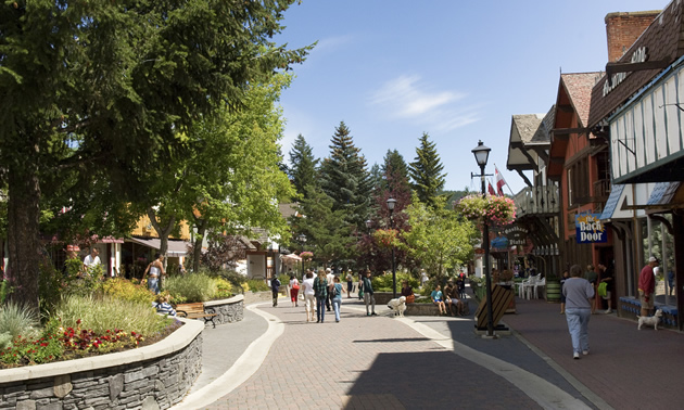 The Kimberley Platzl has Bavarian-themed buildings, green space, and a brick walkway.