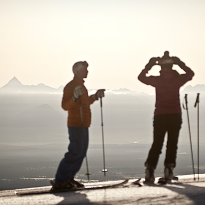 Skiers at Kimberley Alpine Resort are silhouetted in the pristine morning light.