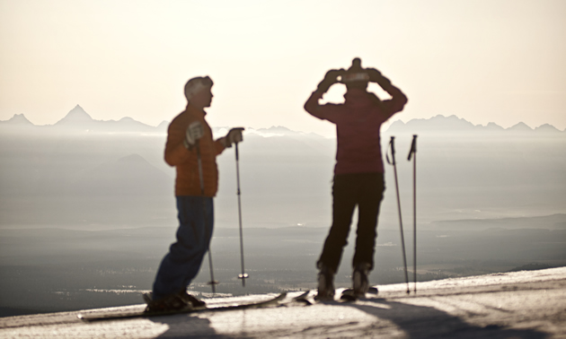 Skiers at Kimberley Alpine Resort are silhouetted in the pristine morning light.