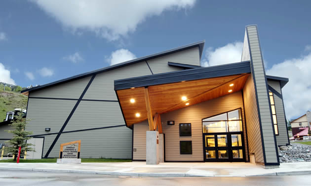 The Kimberley Conference and Athlete Training Centre is a grey building with navy highlights, plenty of wood accents and some strong angles.