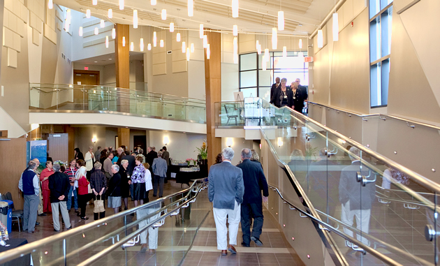 The Kimberley Conference and Athlete Training Centre has a stunning reception area with hanging lights, an elevated walkway and wood accents.