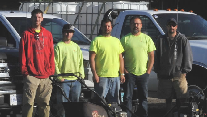 Picture of some of the crew members of Kiss My Grass Ltd., in Fruitvale, B.C. 
