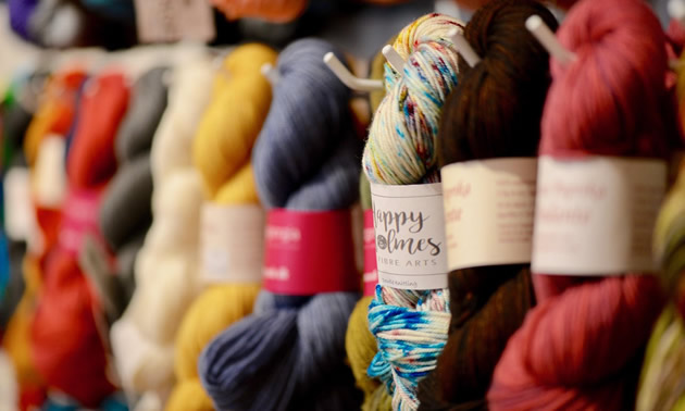 A close-up of colorful skeins of yarn