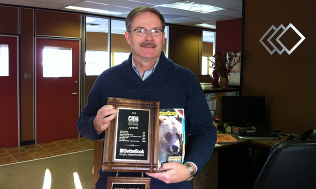 Publisher Keith Powell, display the winning cover and the CIDA award