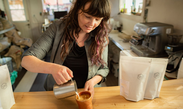 Illana Cameron pouring coffee into cup. 