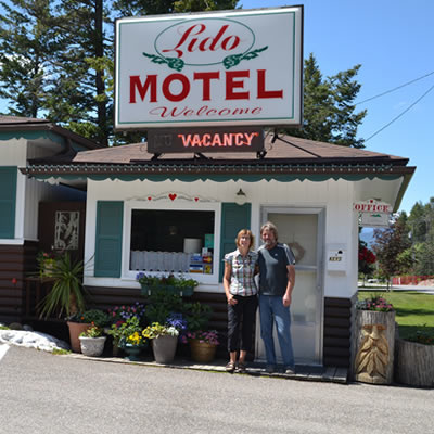 Owners Gabriele and Frank Lorenz are standing in front of the Lido Motel in Radium Hot Springs, B.C.