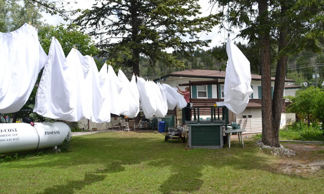 White sheets are hanging on a clothesline at the Lido Motel.
