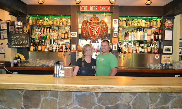 Carly Hadfield and Troy Pyett behind the bar at the Lion's Head pub in Castlegar