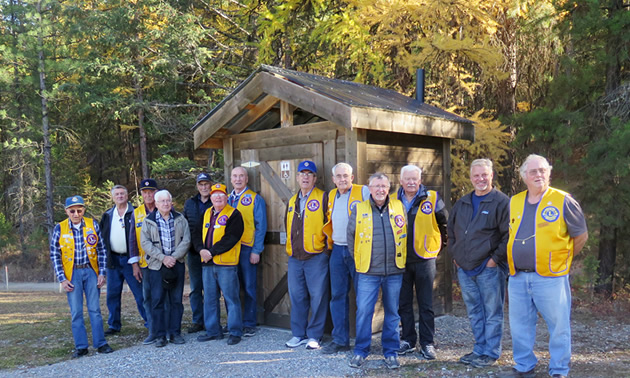 Members of the Cranbrook Lions are pictured in front of one of the four wheelchair-accessible outhouses they recently constructed for Wycliffe Regional Park.