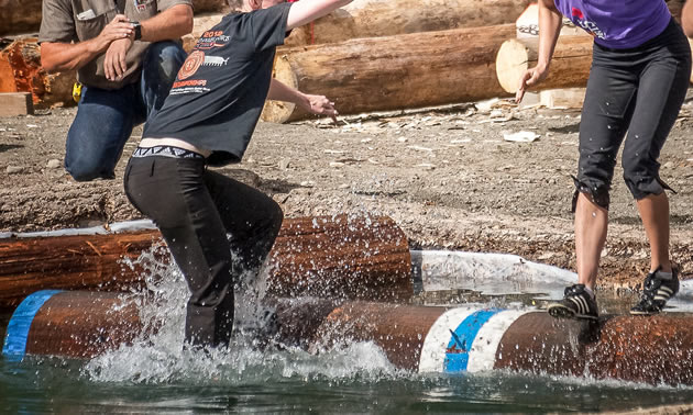 Two young women try their skills at logrolling during Logger Sports in Kaslo, B.C.