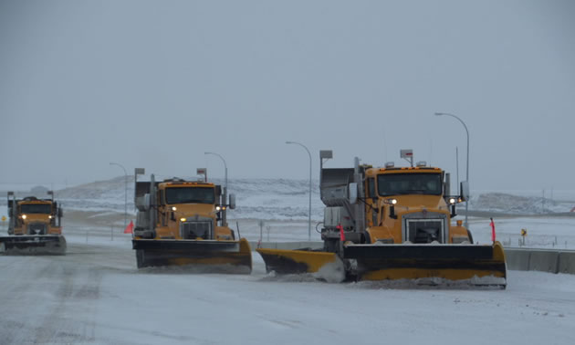 A fleet of Mainroad Contracting's snowplows busy clearing our local highways