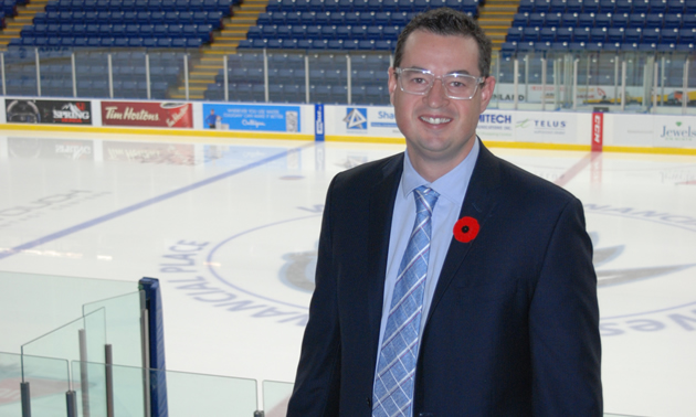 Matt Cockell, the president, general manager and co-owner of the Kootenay Ice Hockey Club, with the empty ice in the background 