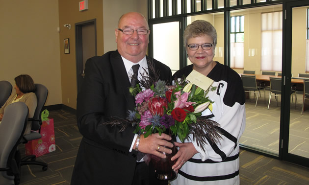 Dean McKerracher, mayor of Elkford, offers congratulations to RDEK CAO Lee-Ann Crane, on her retirement after 37 years with the organization.