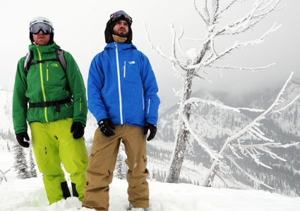 Two men at top of snowy mountain