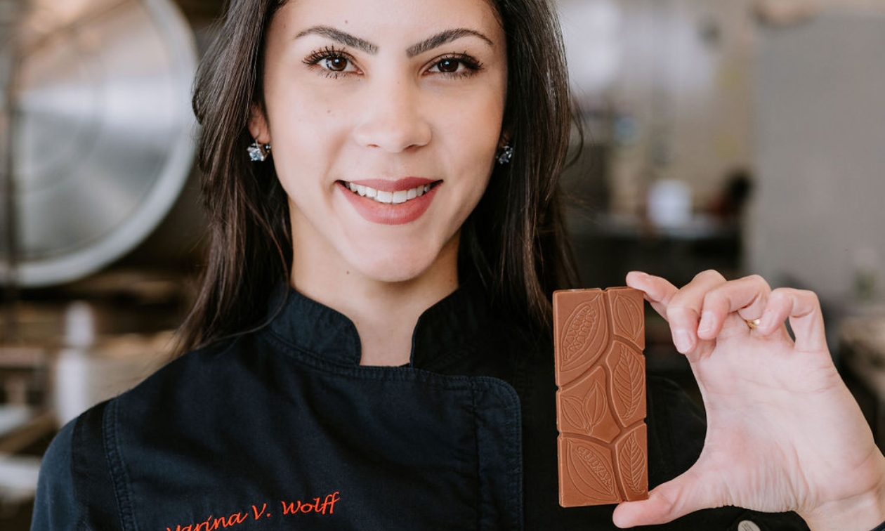 Marina holding a bar of chocolate