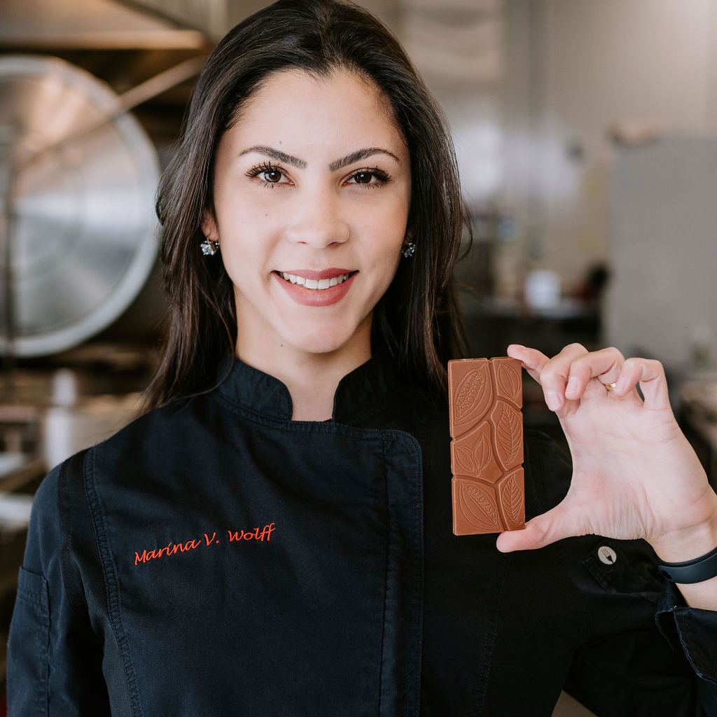 Marina holding a bar of chocolate