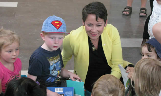 Melanie Mark, minister of advanced education, skills and training, listens to children enrolled in the Early Childhood Education Program at College of the Rockies on May 25, 2018.
