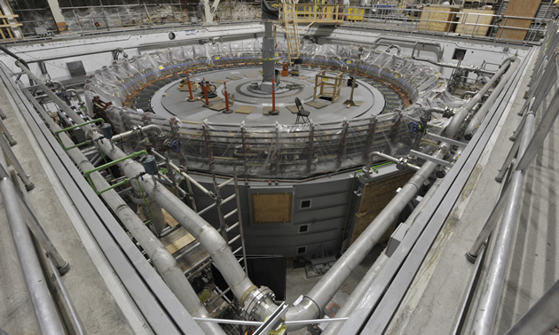 A generator nearing completion at Mica Generating Station, before the generator covers are installed