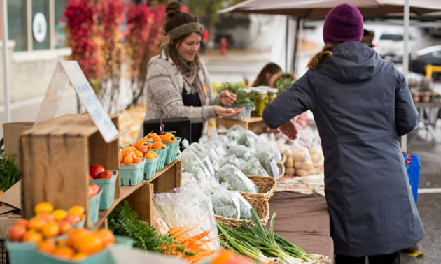The Happy Hills Farm booth at a market.