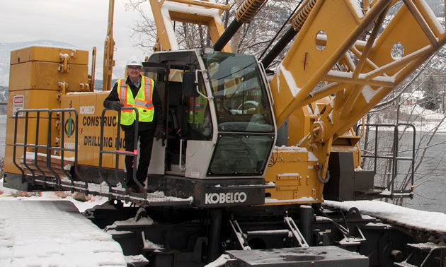 Mayor Mike Martin with heavy equipment that will be used to construct the City of Trail's pipeline/pedestrian bridge.