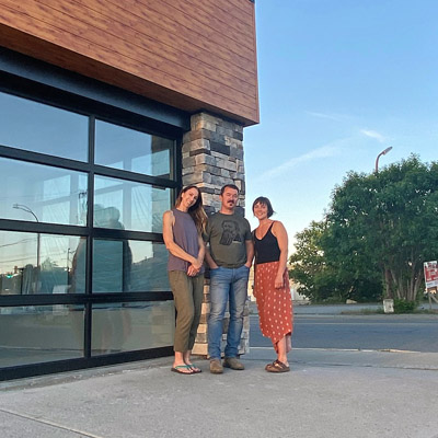 (L to R) Corinna Robinson, Mike Robinson and Christel Hagn stand in front of the Morchella Market building. 