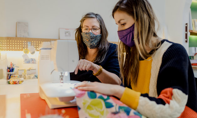 Student and teacher sewing. 