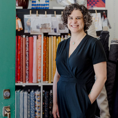 Laura Kirby standing by door. 