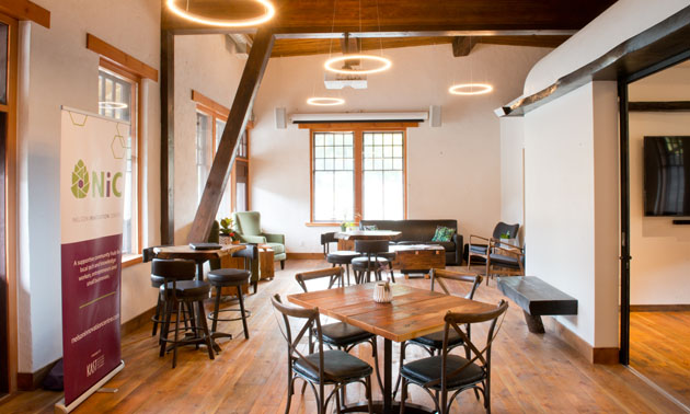 Inside of new Nelson Innovation Centre, showing tables and chairs. 