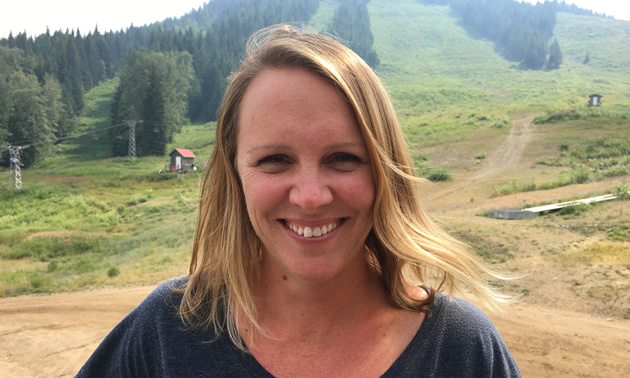Nicole Briggs, the marketing and events manager at Red Mountain Resort In Rossland, B.C., stands for a moment at the bottom of the ski hill in August