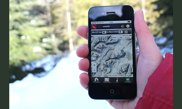 Photo of someone holding an iPhone displaying the new app upgrade to help improve avalanche forecasting