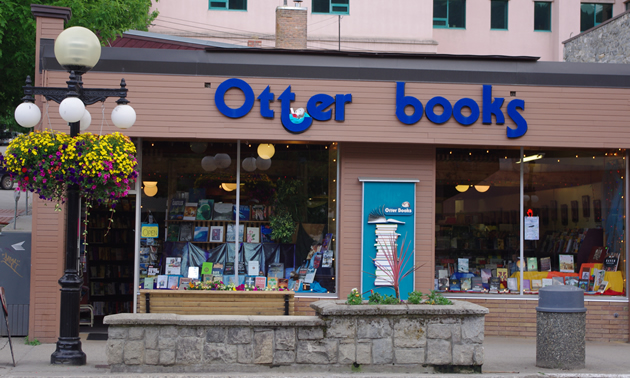 Storefront carrying the words Otter Books above large windows showing displays of books