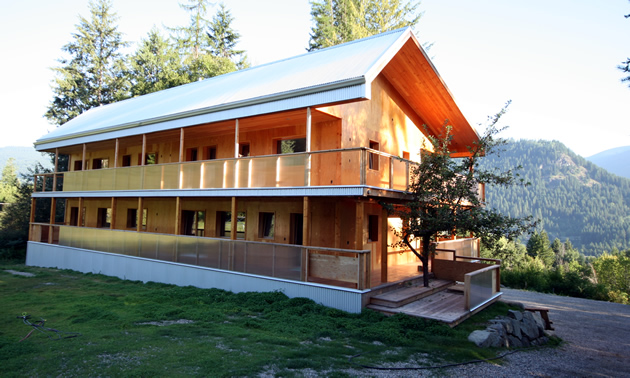 An artist point of view looks up at two levels of Passive House.