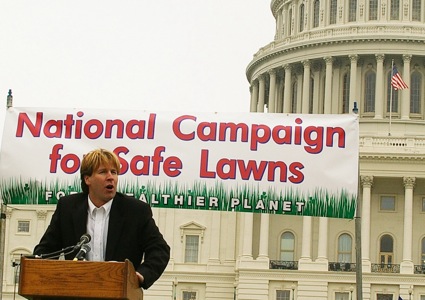 A man speaks from a podium at a rally