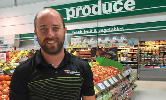 Brian Pealow, owner of Pealow's grocery store in Creston, in the store's colourful produce department