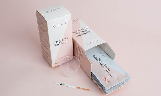 Boxes of Ovry pregnancy strips, one box is open. 