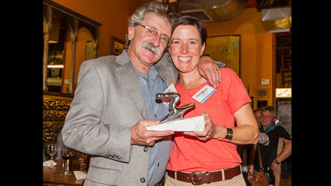 Christine Andison, President of Red Mountain Racers,  accepting the award from Bruce Goldsmid, BC Alpine's CEO. 