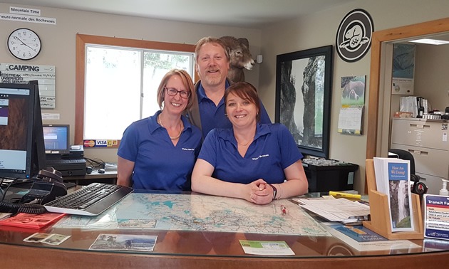 (L to R) Roberta Hall, Kent Kebe and Kara Cassidy welcome people to the Radium Hot Springs Visitor Centre.