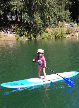 Raddison Ryman takes after her mom on a stand-up paddleboard.