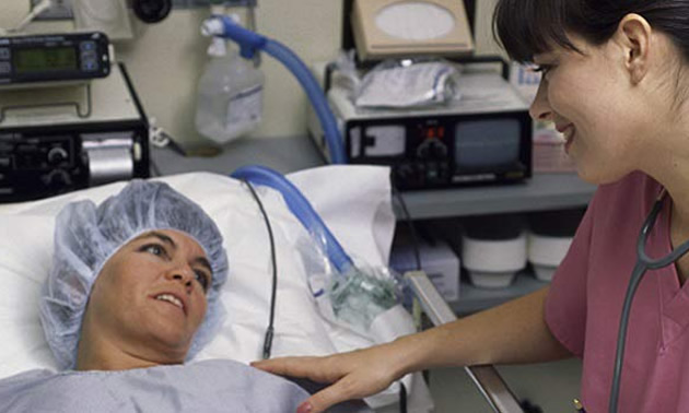 Nurse looking after patient. 