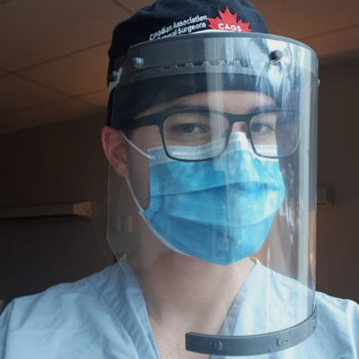 Medical professional wearing face shield. 