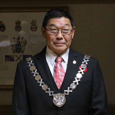Ron Toyota, mayor of Creston, wearing his chain of office