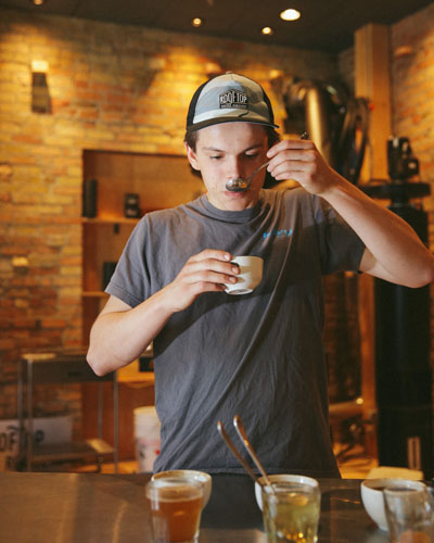 Keegan Street sampling coffee. 